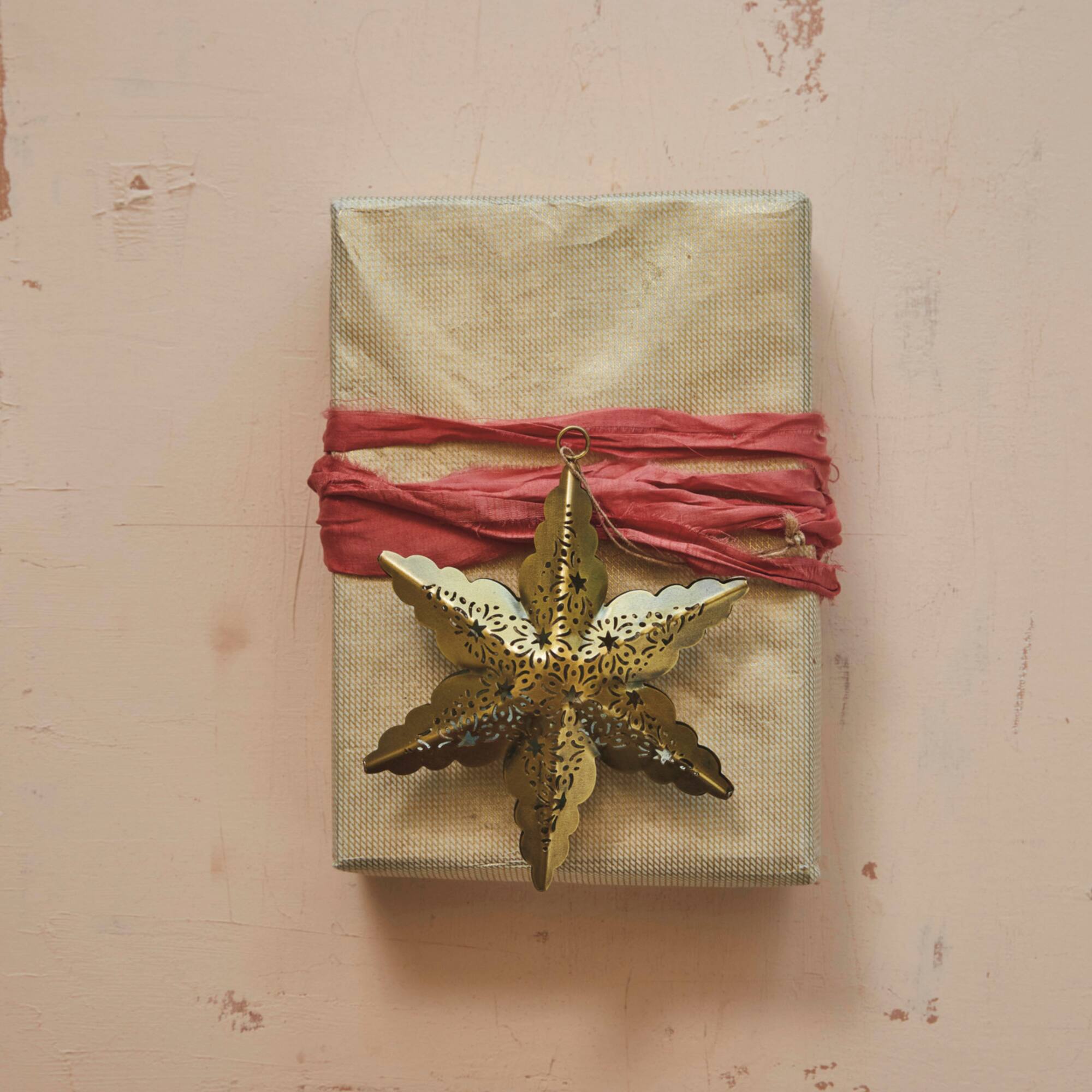 Hello Honey® 12 Pack 5.75" Antique Brass Electroplated Metal Laser Cut Star Ornaments